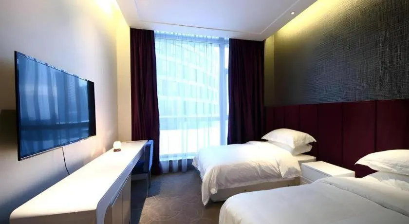 Bed in Harbin Ju Jian Hotel