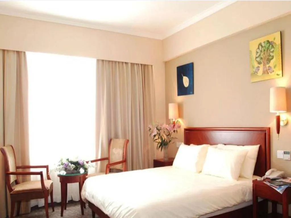 Bed in GreenTree Inn Beijing Daxing Xingye Street Liyuan Business Hotel