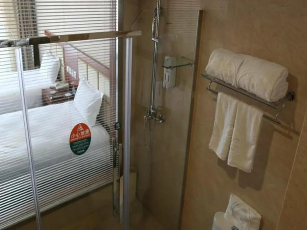 Bed in GreenTree Inn Beijing Daxing Xingye Street Liyuan Business Hotel