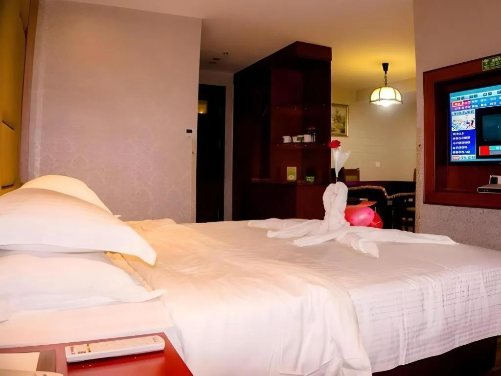 Bed in GreenTree Inn Ganzhou Sankang Temple DaRunFa Express Hotel