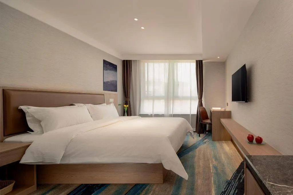 Bed in GreenTree Inn Ganzhou Sankang Temple DaRunFa Express Hotel