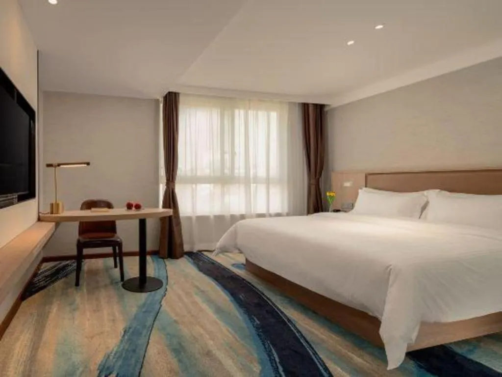 Bed in GreenTree Inn Ganzhou Sankang Temple DaRunFa Express Hotel