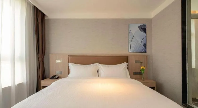 Bed in GreenTree Inn Ganzhou Sankang Temple DaRunFa Express Hotel