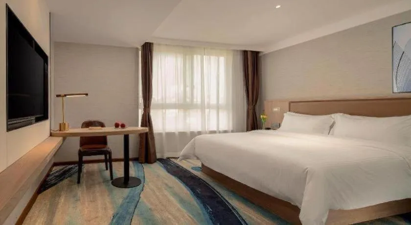 Bed in GreenTree Inn Ganzhou Sankang Temple DaRunFa Express Hotel