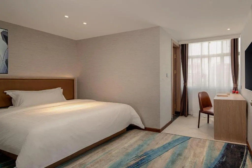 Bed in GreenTree Inn Ganzhou Sankang Temple DaRunFa Express Hotel