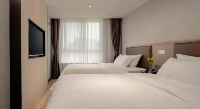 Bed in GreenTree Inn Ganzhou Sankang Temple DaRunFa Express Hotel