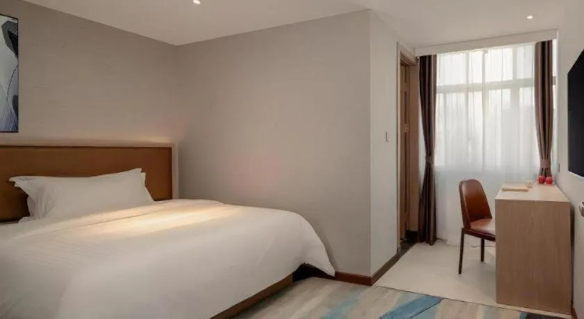 Bed in GreenTree Inn Ganzhou Sankang Temple DaRunFa Express Hotel