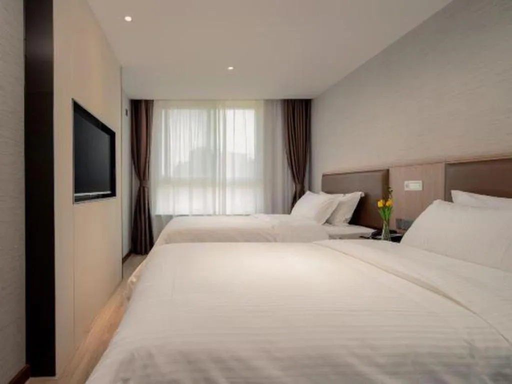 Bed in GreenTree Inn Ganzhou Sankang Temple DaRunFa Express Hotel