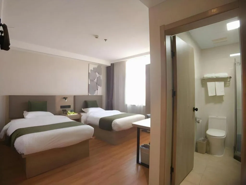 Bed in GreenTree Inn Xuzhou High Speed Railway Station Express Hotel