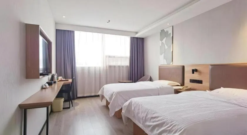 Bed in GreenTree Inn Nanjing Dachang Getang Metro Station Express Hotel