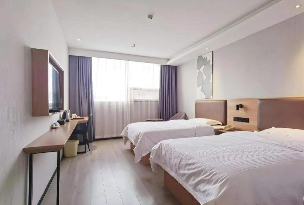 Bed in GreenTree Inn Nanjing Dachang Getang Metro Station Express Hotel