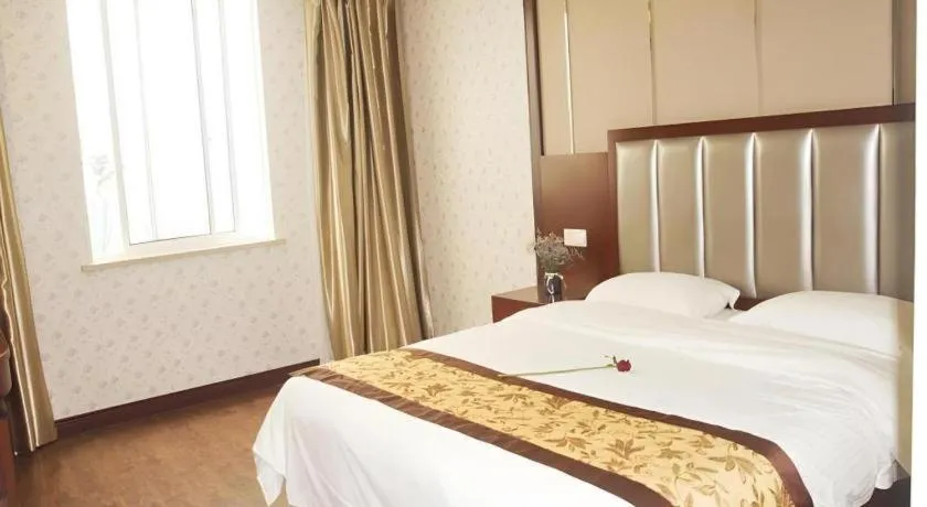 Bed in GreenTree Inn JiangSu Wuxi Jiangyin City QinGYAng Town Fuqian Road Express Hotel