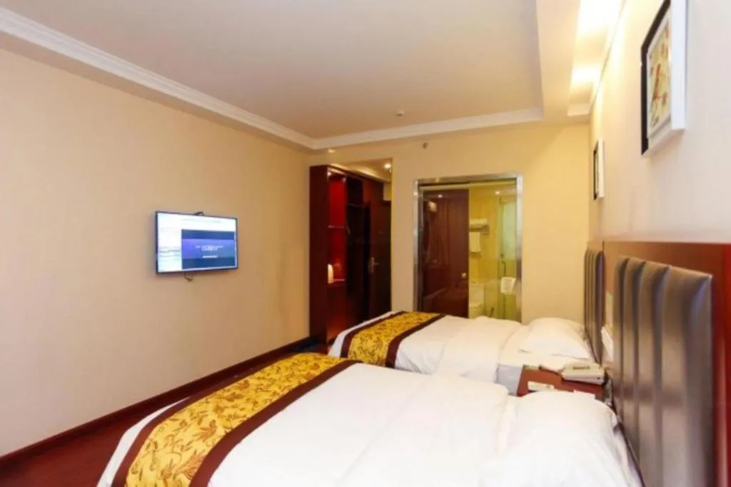Bed in GreenTree Inn JiangSu Wuxi Jiangyin City QinGYAng Town Fuqian Road Express Hotel