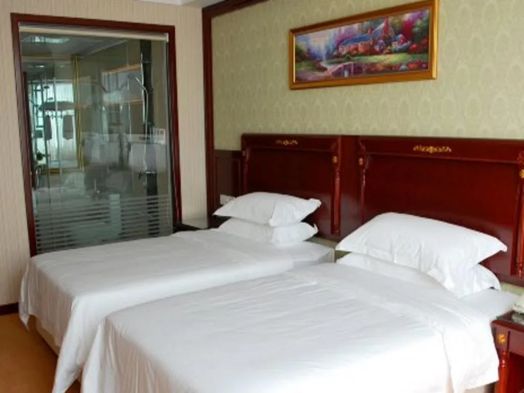 Bed in Vienna Hotel Qingdao Jiaozhou Branch