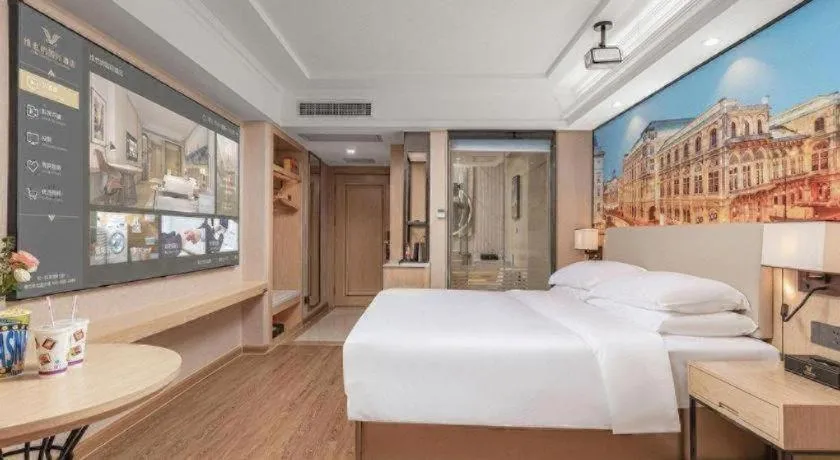 Bed in Vienna International Hotel Guangzhou Baiyun Dayuanli Plaza