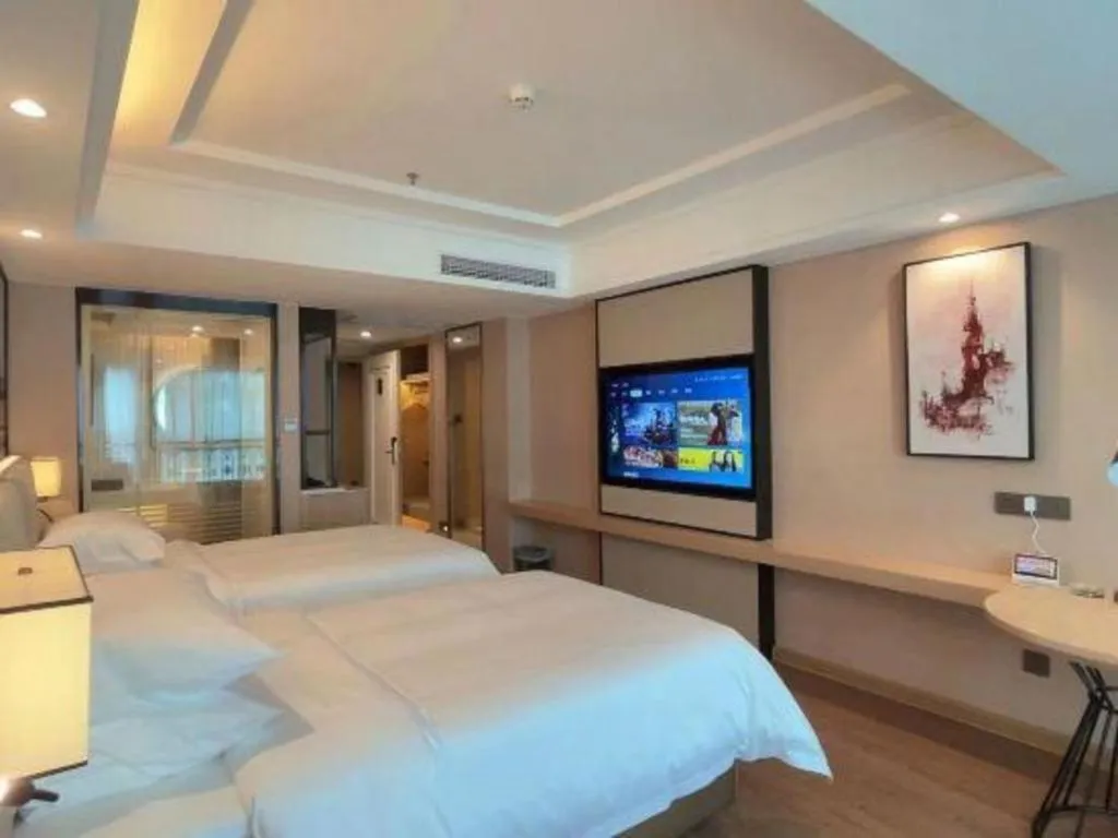 Bed in Vienna International Hotel Guangzhou Baiyun Dayuanli Plaza