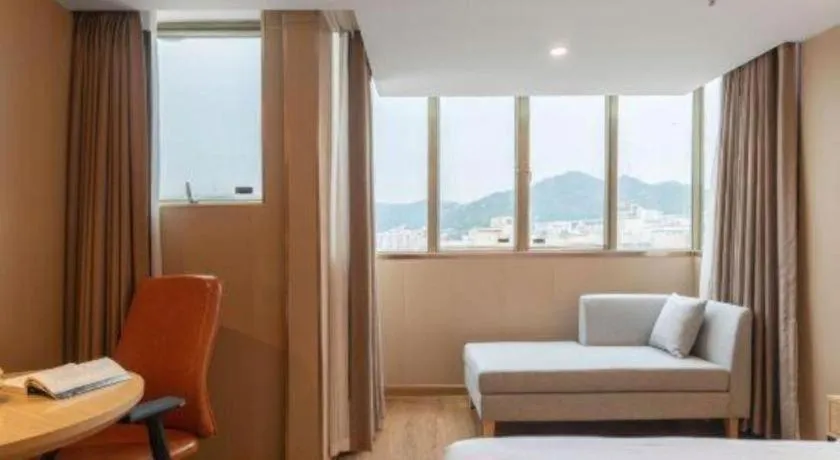 Bed in Vienna International Hotel Guangzhou Baiyun Dayuanli Plaza