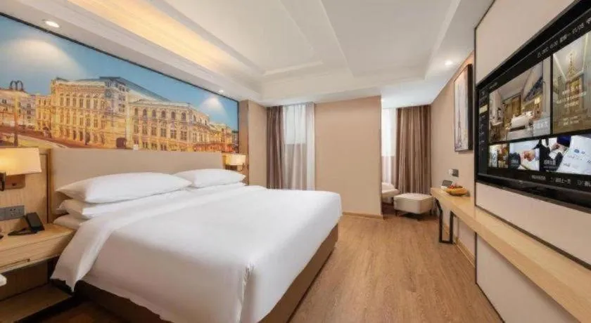 Bed in Vienna International Hotel Guangzhou Baiyun Dayuanli Plaza