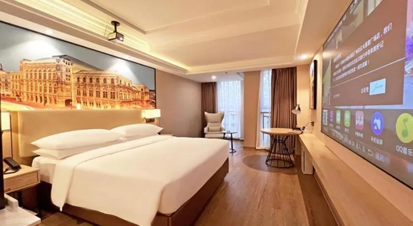 Bed in Vienna International Hotel Guangzhou Baiyun Dayuanli Plaza