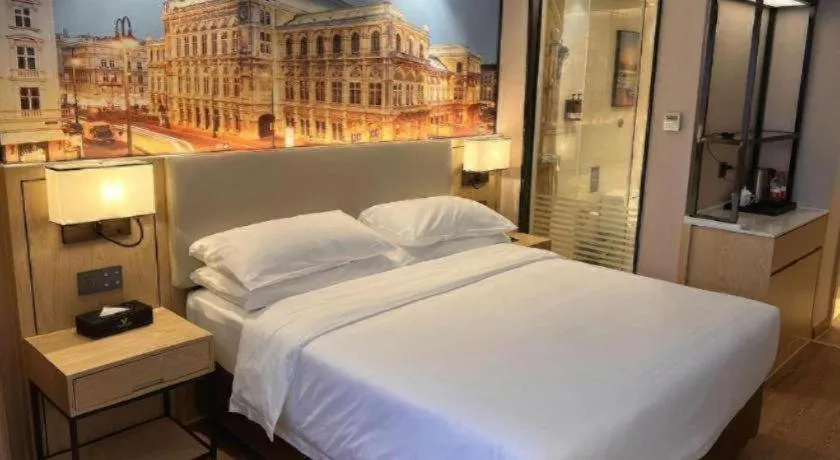 Bed in Vienna International Hotel Guangzhou Baiyun Dayuanli Plaza