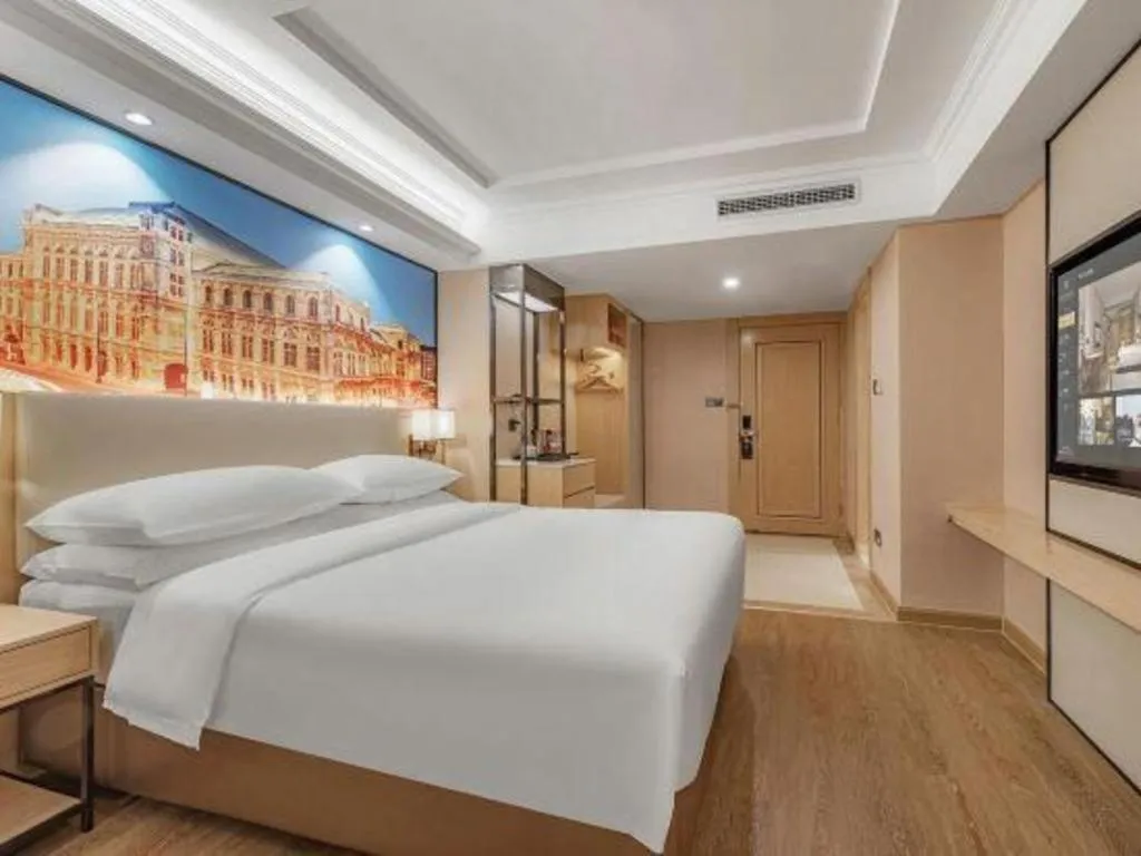 Bed in Vienna International Hotel Guangzhou Baiyun Dayuanli Plaza