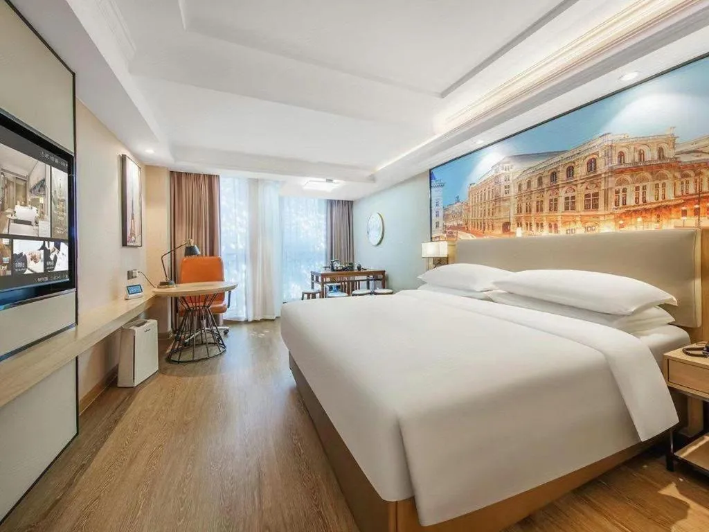 Bed in Vienna International Hotel Guangzhou Baiyun Dayuanli Plaza