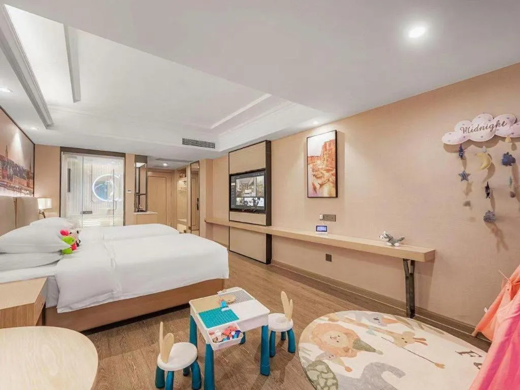 Bed in Vienna International Hotel Guangzhou Baiyun Dayuanli Plaza