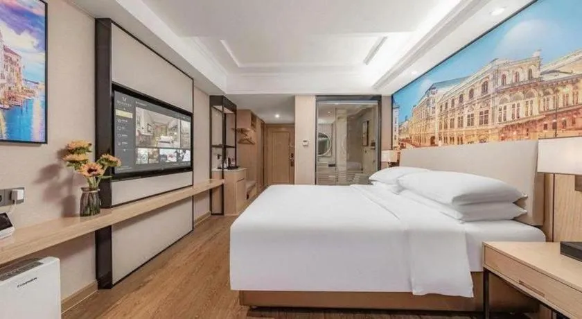 Bed in Vienna International Hotel Guangzhou Baiyun Dayuanli Plaza