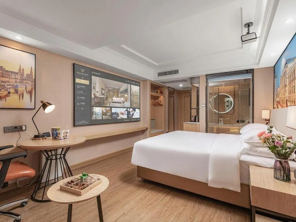 Bed in Vienna International Hotel Guangzhou Baiyun Dayuanli Plaza