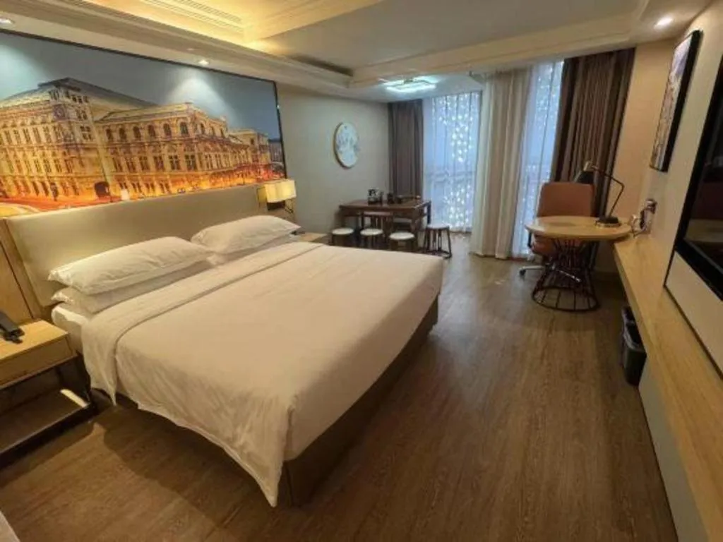 Bed in Vienna International Hotel Guangzhou Baiyun Dayuanli Plaza