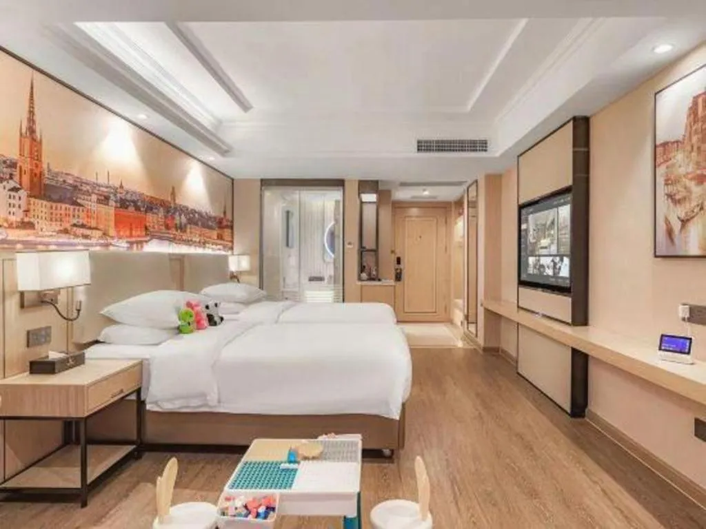 Bed in Vienna International Hotel Guangzhou Baiyun Dayuanli Plaza