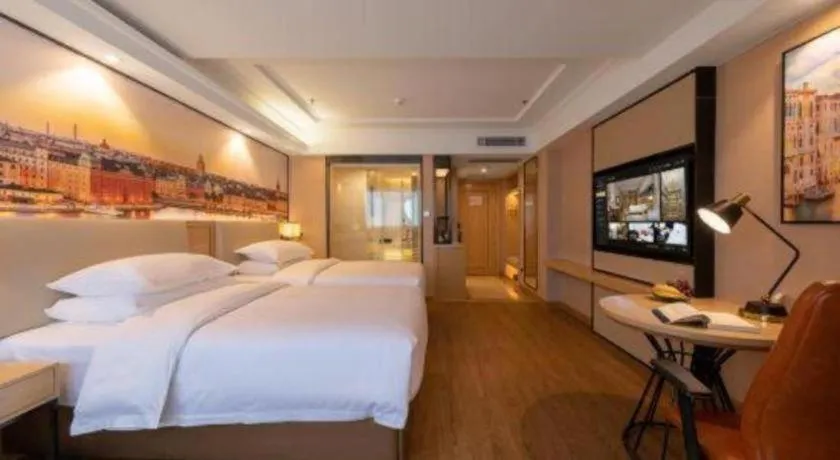 Bed in Vienna International Hotel Guangzhou Baiyun Dayuanli Plaza