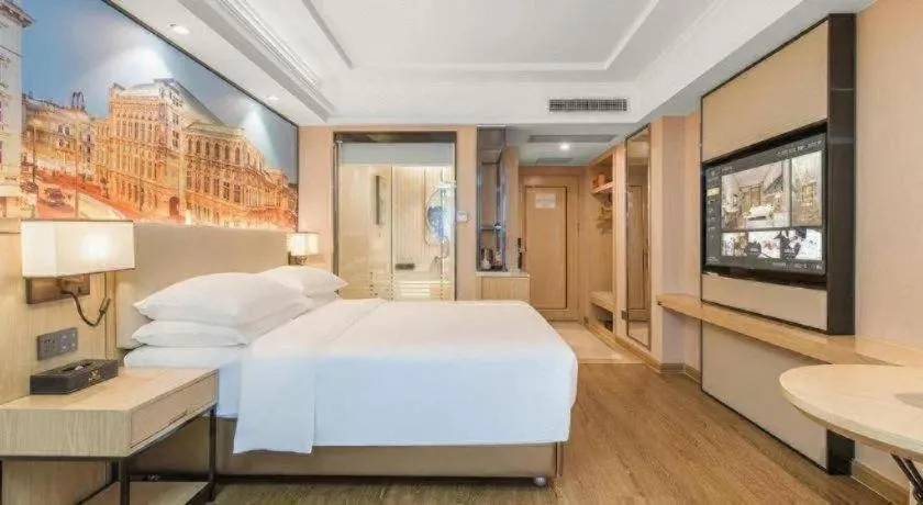 Bed in Vienna International Hotel Guangzhou Baiyun Dayuanli Plaza