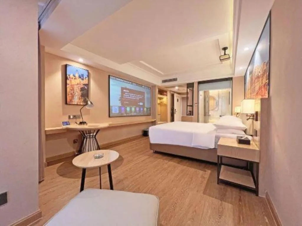 Bed in Vienna International Hotel Guangzhou Baiyun Dayuanli Plaza