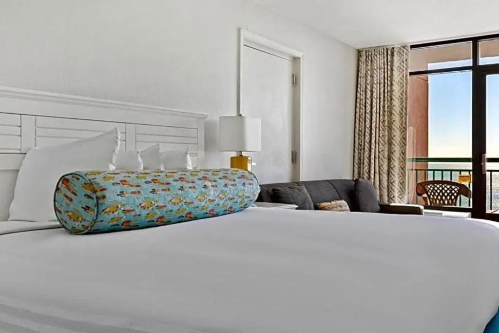 Bed in Sand Castle Resort by Patton Hospitality