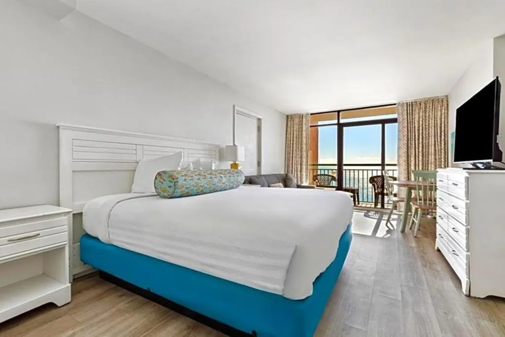 Bed in Sand Castle Resort by Patton Hospitality