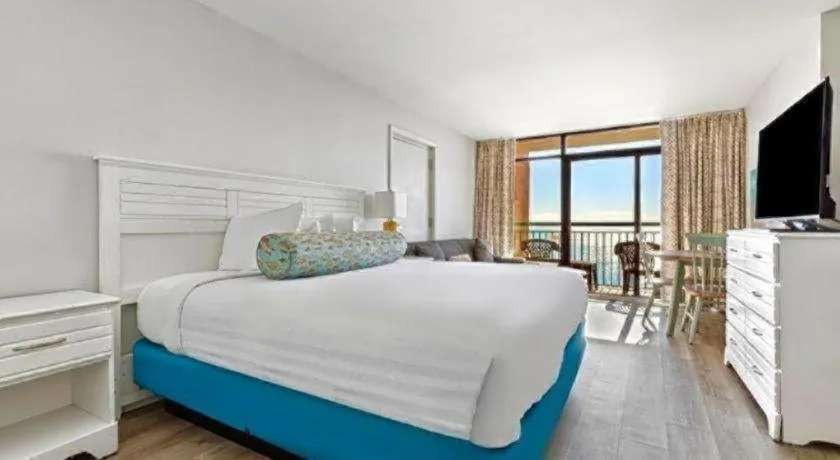 Bed in Sand Castle Resort by Patton Hospitality