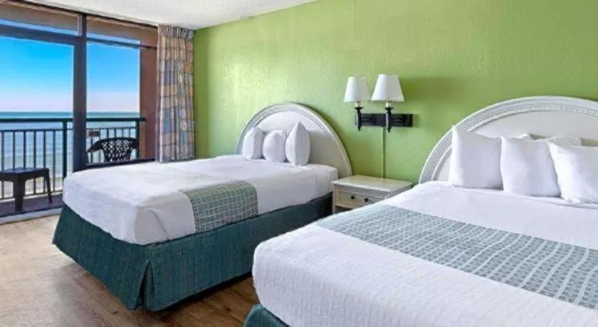 Bed in Sand Castle Resort by Patton Hospitality