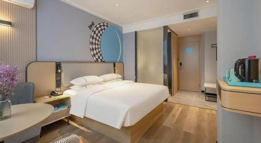 Bed in City Comfort Inn Wuzhou Municipal Square