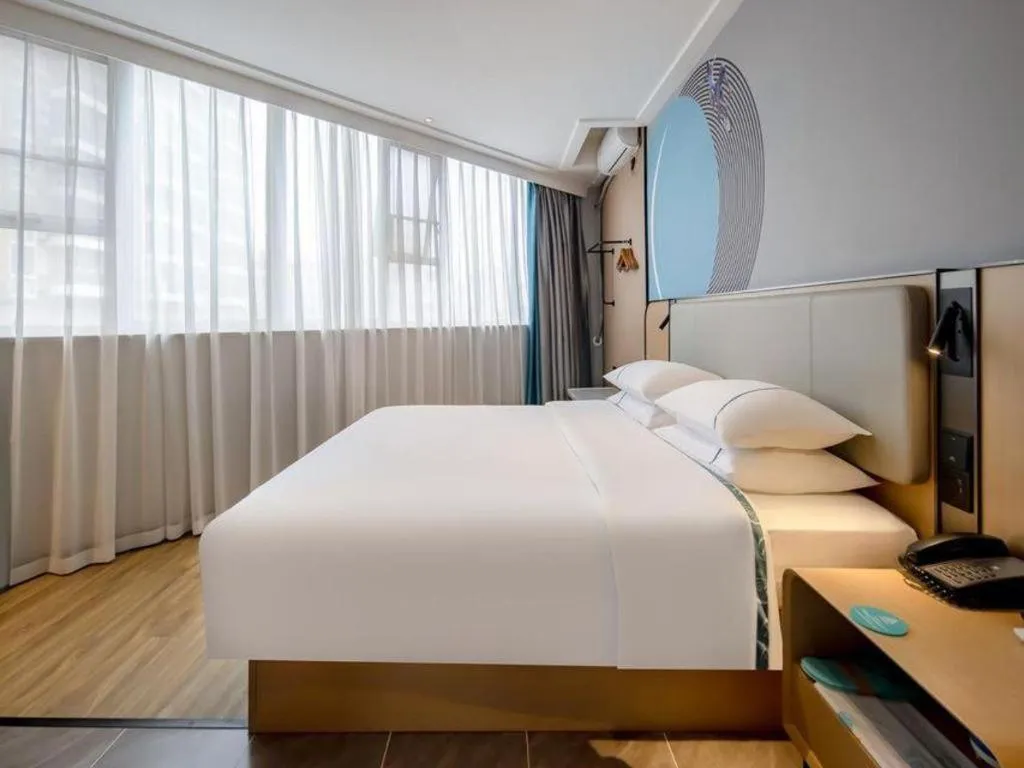 Bed in City Comfort Inn Wuzhou Municipal Square