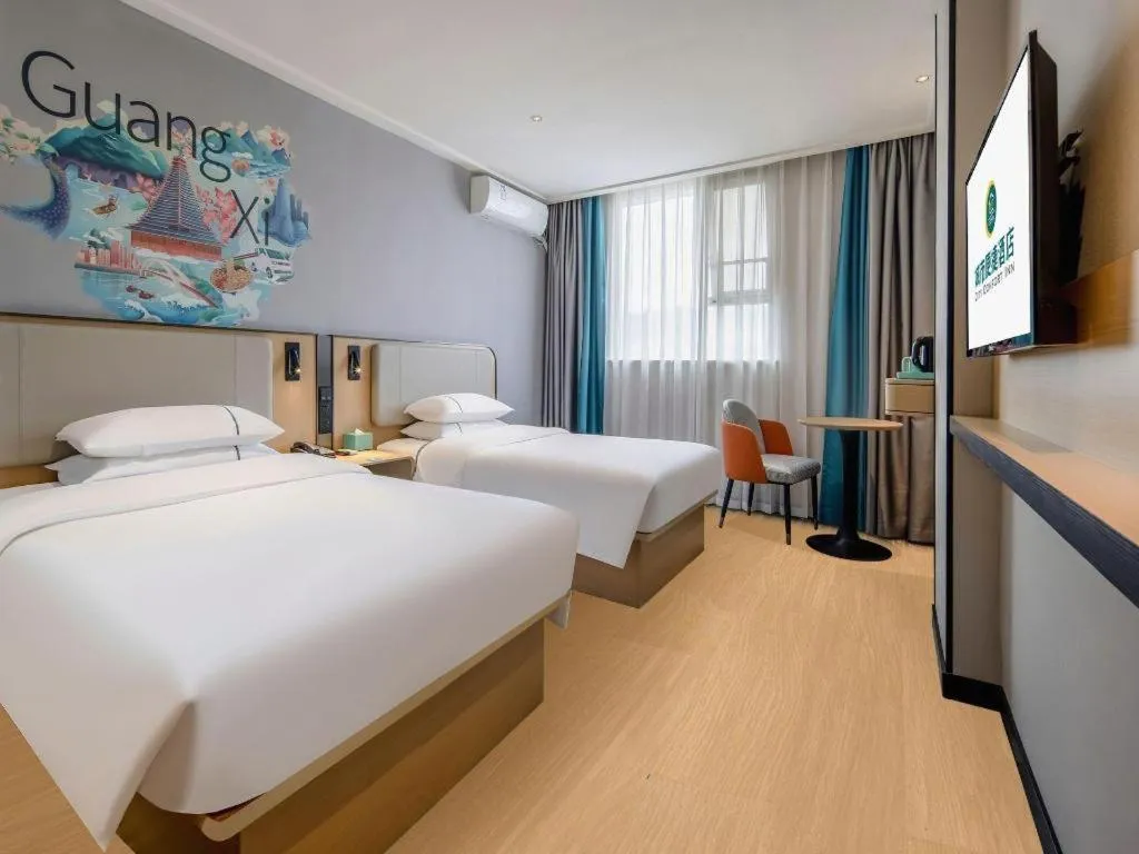 Bed in City Comfort Inn Wuzhou Municipal Square
