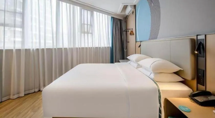 Bed in City Comfort Inn Wuzhou Municipal Square