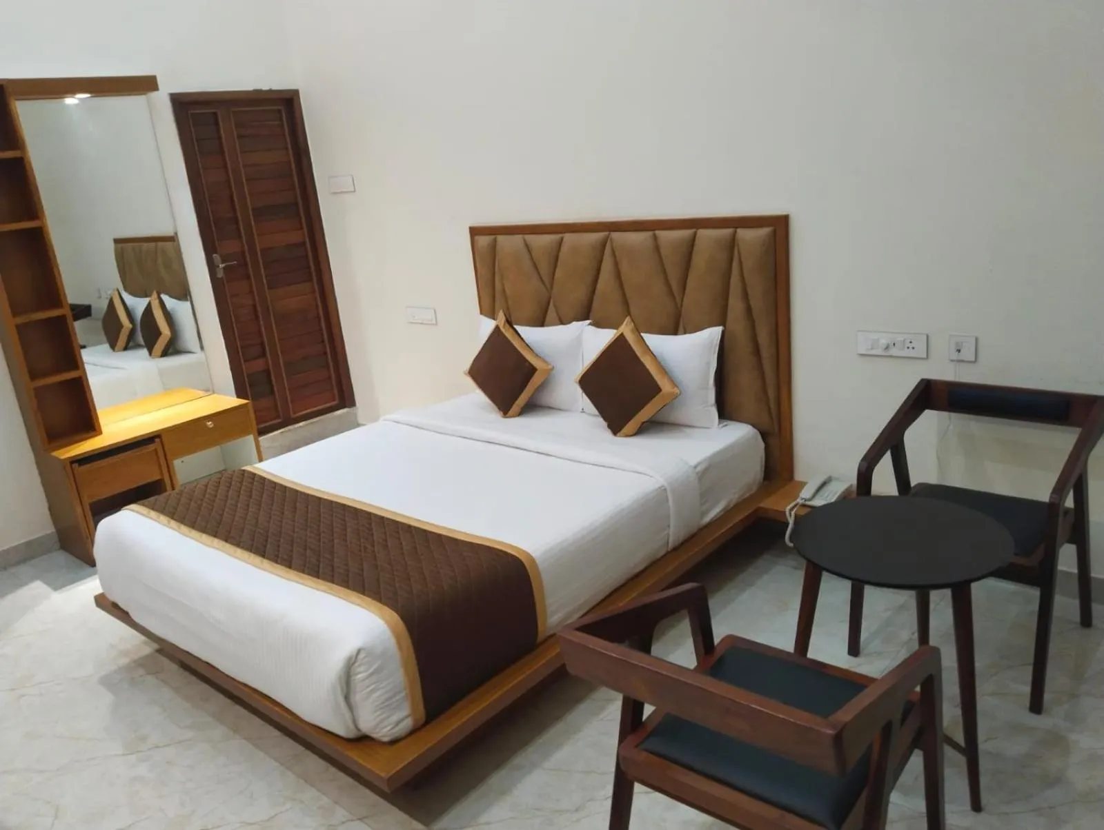 Bed in AR Phalazzo Resort and Banquets