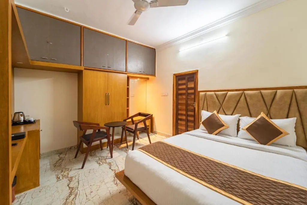 Bed in AR Phalazzo Resort and Banquets