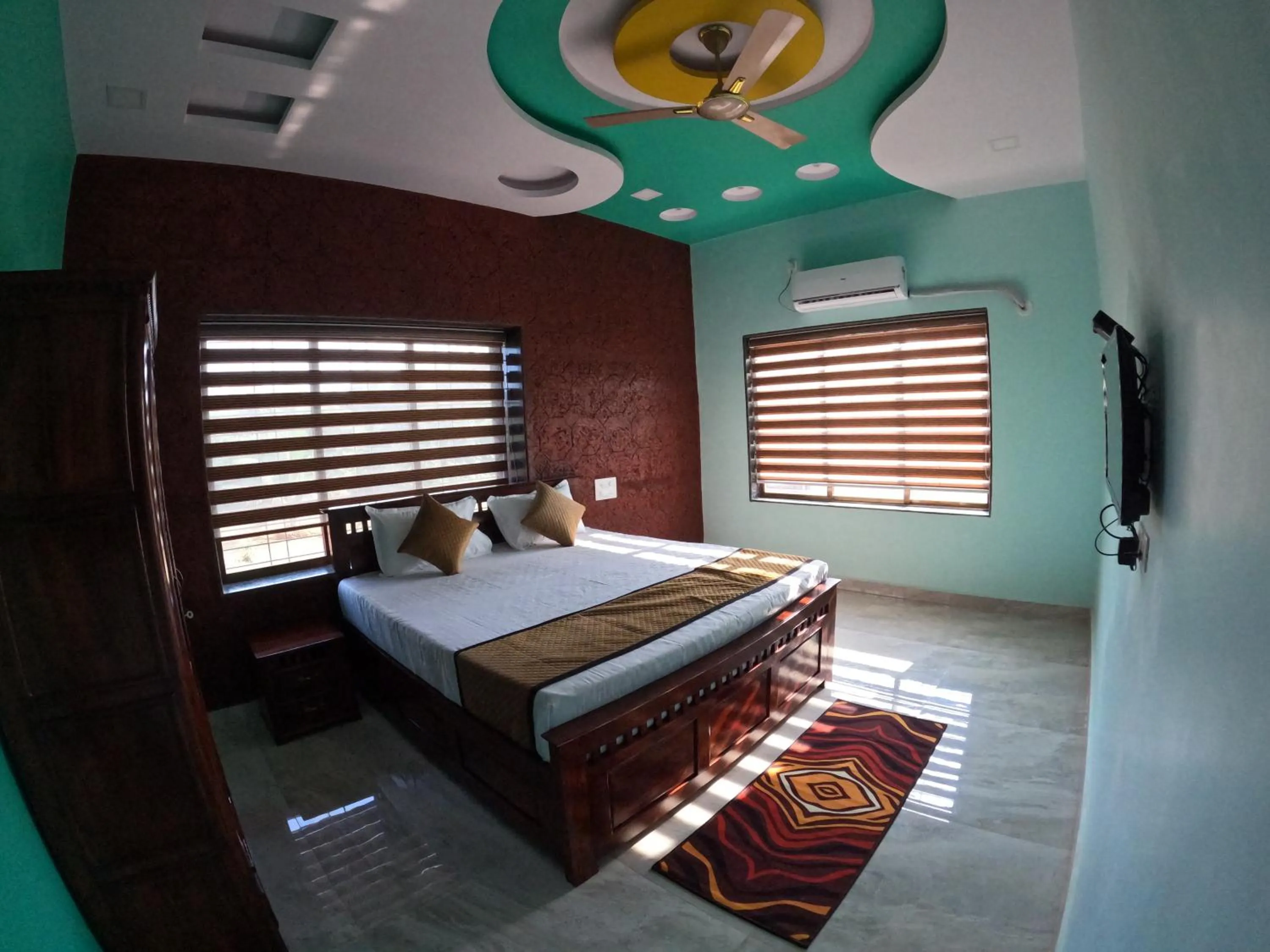 Bed in Kokan Heritage Resort
