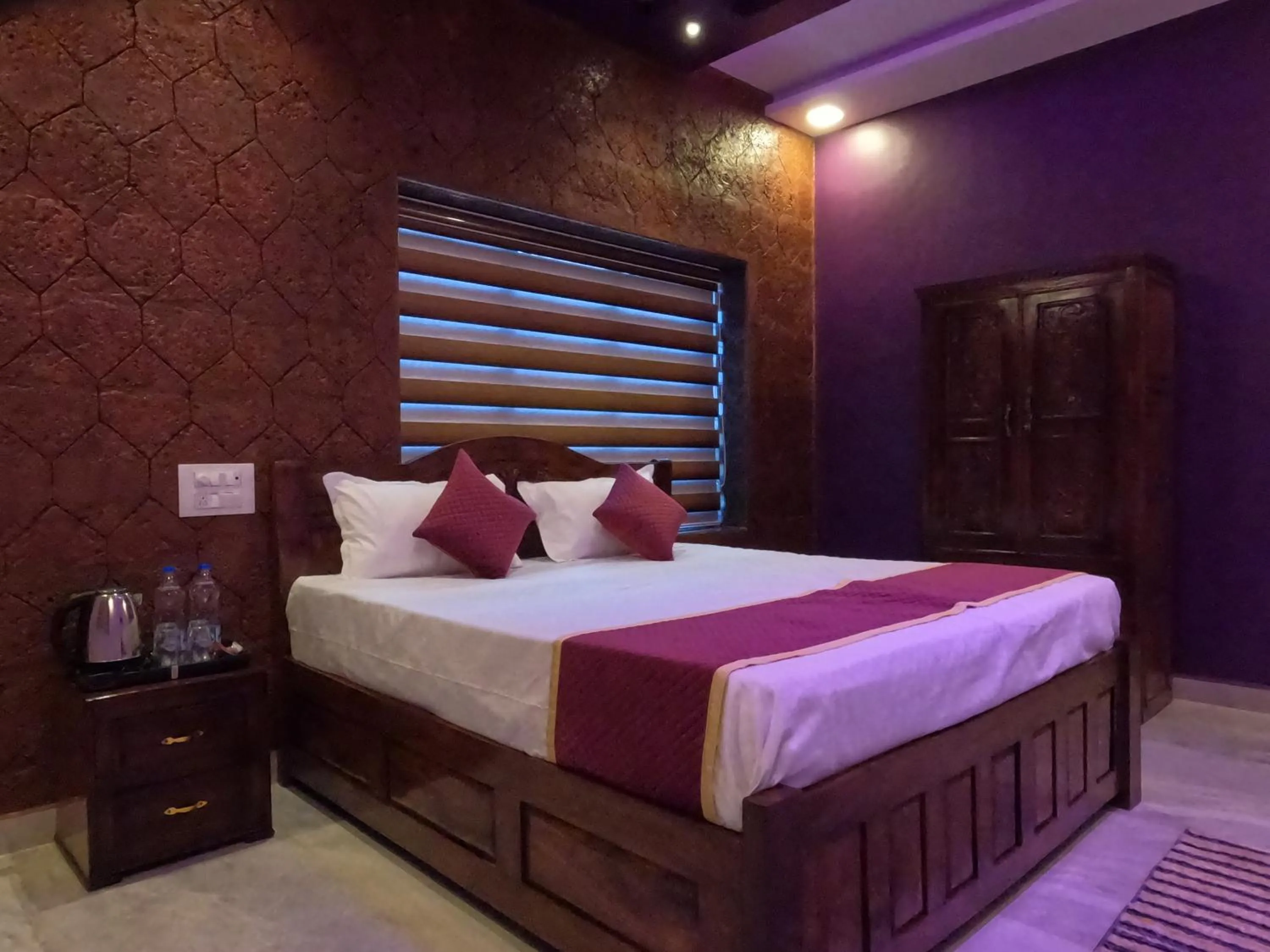 Bed in Kokan Heritage Resort