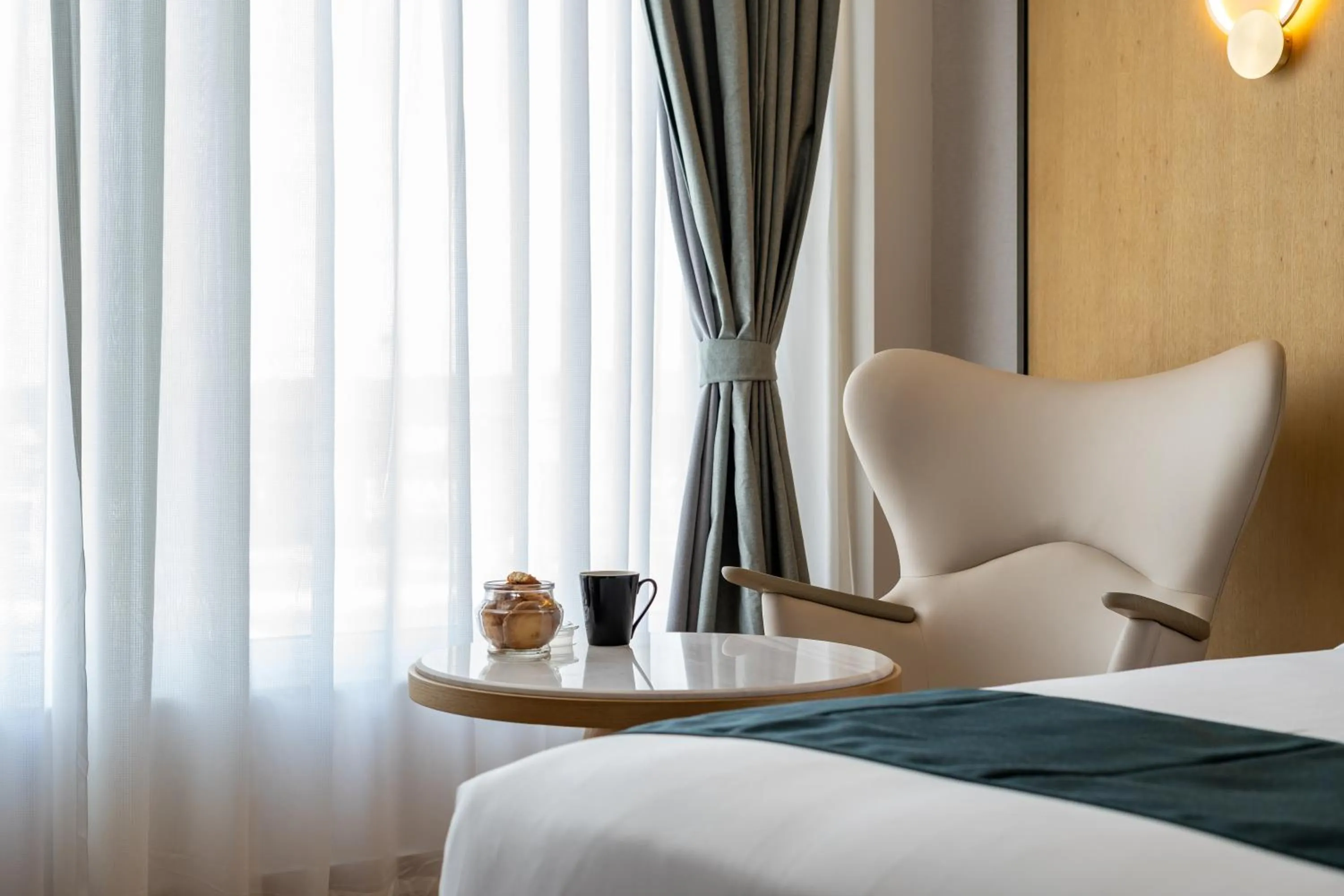 Seating area, Bed in Copper Leaf Hotels, Tirunelveli