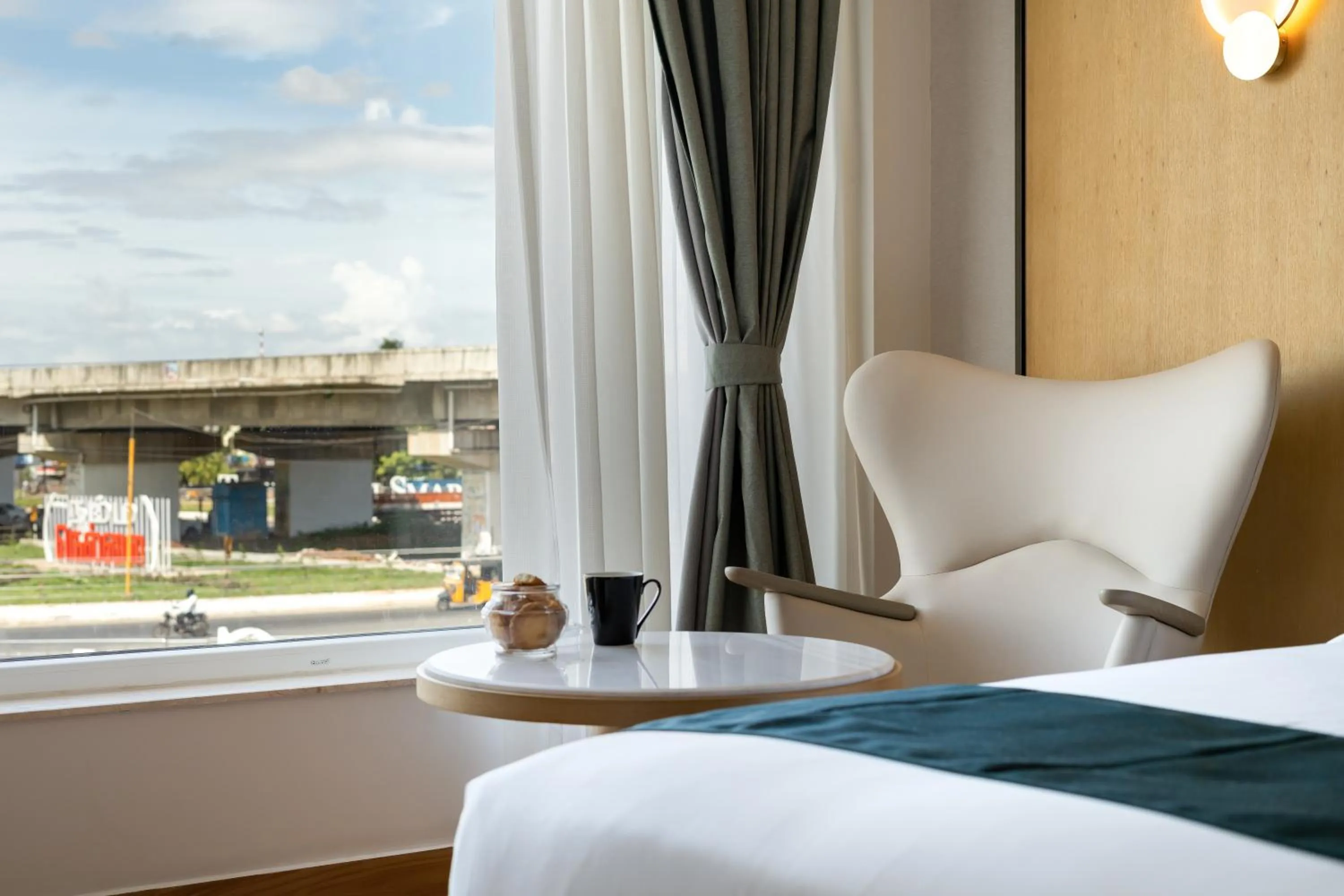 Seating area, Bed in Copper Leaf Hotels, Tirunelveli