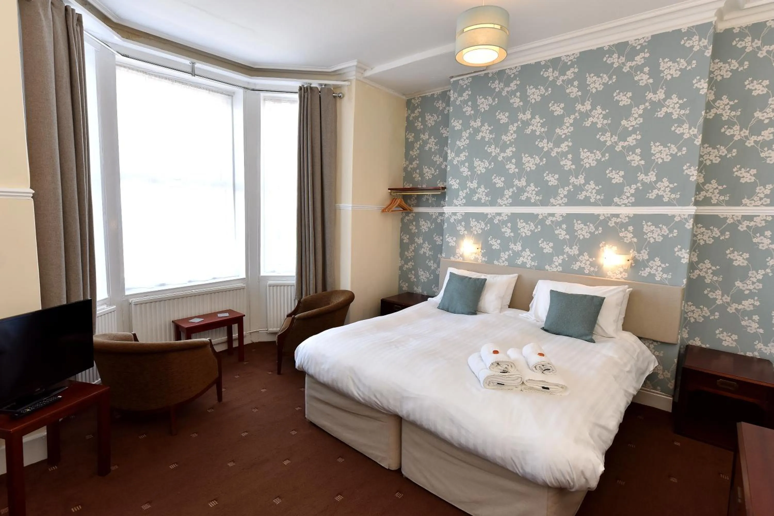 Bed in Phoenix Court Hotel