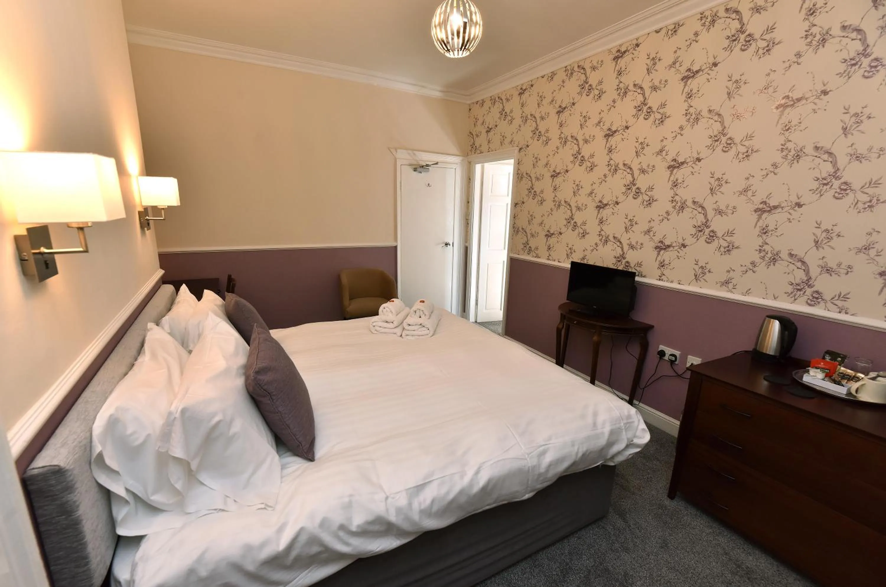 Bed in Phoenix Court Hotel